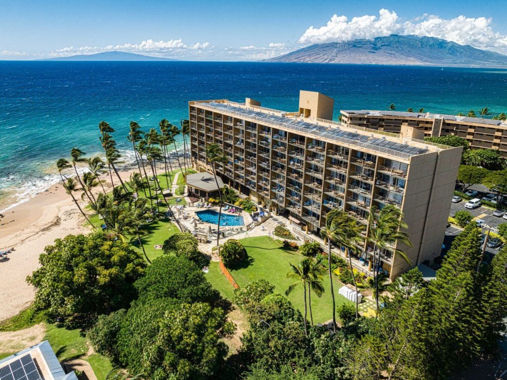 Aerial view of Mana Kai Maui beachfront condo on Keawakapu Beach with ocean and mountain backdrop