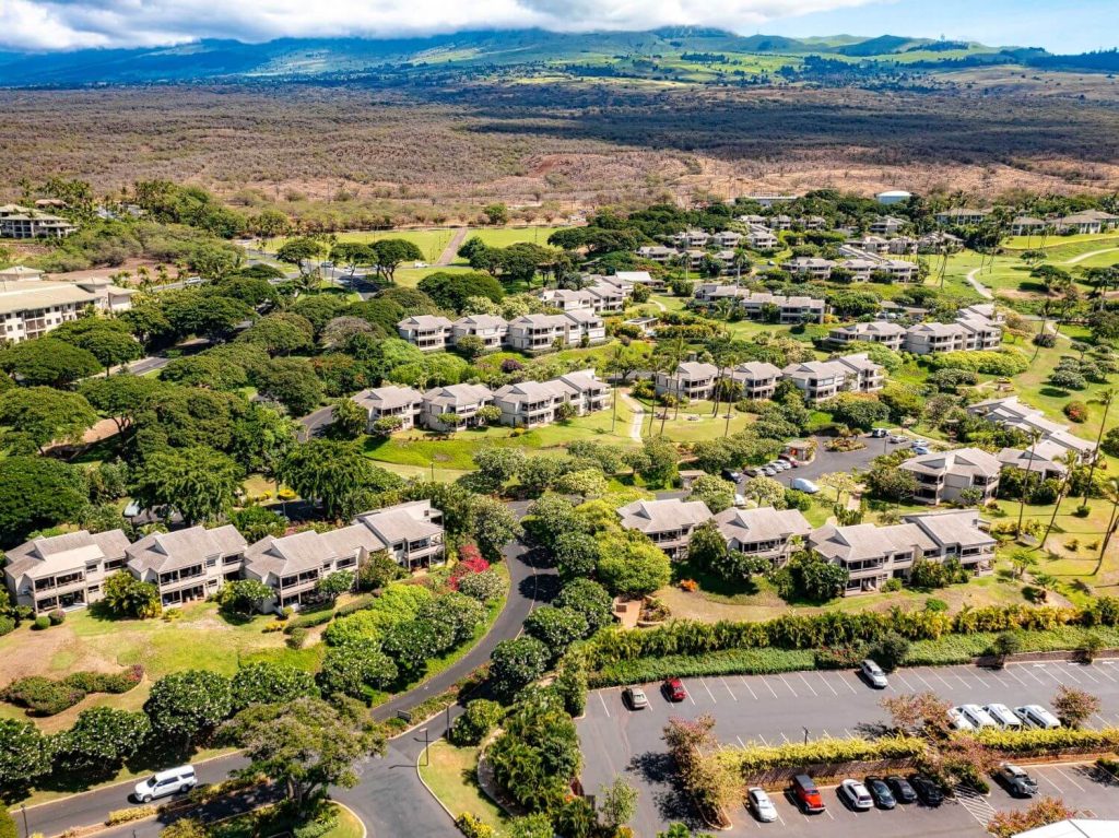 Aerial view of Wailea Ekolu Village condo complex in Wailea Maui with lush landscaping, ocean views, and golf course surroundings.
