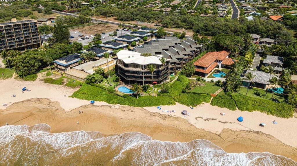 Aerial view of Hale Hui Kai beachfront condos on Keawakapu Beach in South Kihei, Maui.