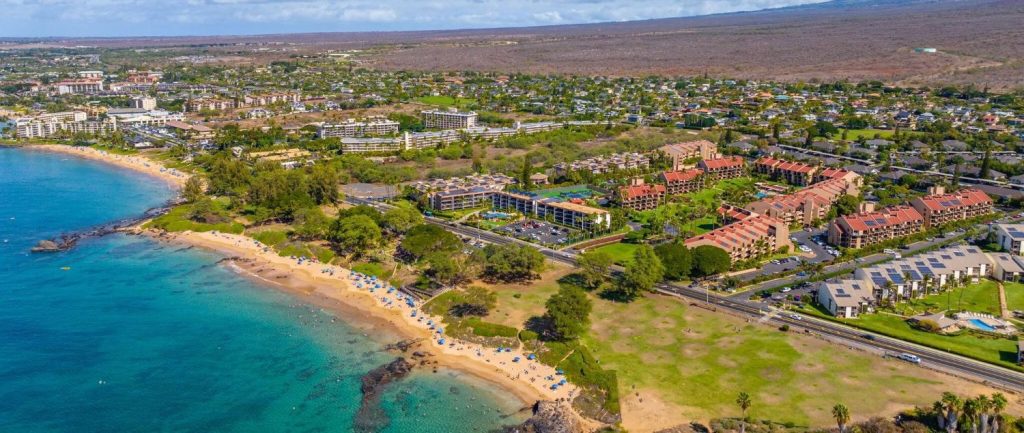 Aerial photo of Haleakala Shores and surrounding South Kihei coastline, featuring Kamaole Beach Park III and nearby condos along South Kihei Road.