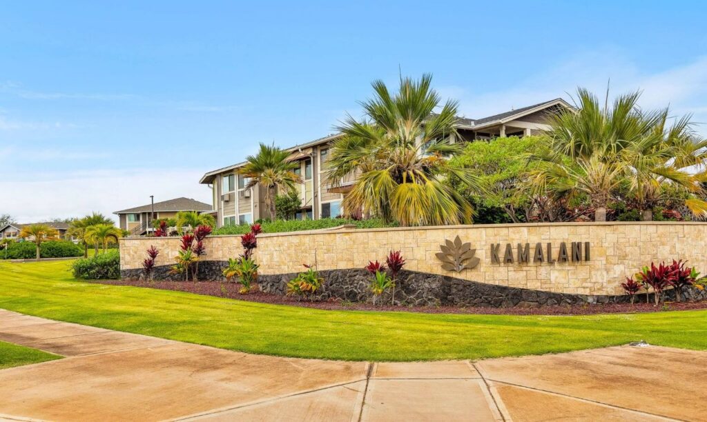 Entrance sign and landscaped grounds at Kamalani condos in North Kihei Maui